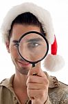 Guy Looking Through Magnifying Lens Stock Photo