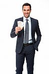 Half Lenth Portrait Of A Businessman Smiling In Falling Money Stock Photo