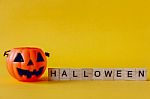 Halloween Jack O Lantern Bucket  On Yellow Background Stock Photo