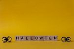 Halloween Wooden Blocks With Spiders On Yellow Background, Hallo Stock Photo