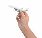 Hand Holding Airplane Toy Model Isolated On White Background Stock Photo