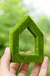Hand Holding Green House Icon Stock Photo