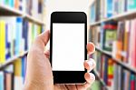 Hand Holding Smart Phone Against Stock Photo
