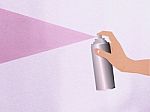 Hand Holding Spray Stock Photo