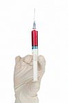 Hand Holding Syringe Stock Photo