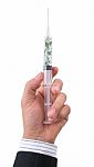 Hand Holding Syringe Filled With Currency Stock Photo