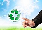 Hand Touching Recycle Sign Stock Photo
