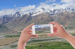 Hand Using Smartphone Photographed Snow Peak Mountain View Backg Stock Photo