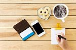 Hand Writing Down On Blank Note Paper With White Cup Of Black Coffee Stock Photo