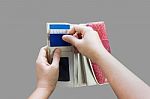 Hands Pull Credit Or Debit Card Out Of Wallet Stock Photo