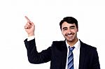 Handsome Businessman Pointing At Something Stock Photo