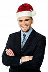 Handsome Businessman Wearing Santa Cap Stock Photo