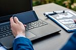 Handsome Businessman Wearing Suit And Using Modern Laptop Outdoo Stock Photo
