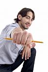 Handsome Cool Man Showing Pencil Stock Photo
