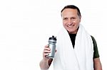 Handsome Man Holding Bottle In Hand Stock Photo