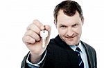 Handsome Realtor Offering House Key Stock Photo