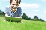 Handsome Young Boy With Tablet Device, Outdoors Stock Photo