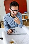 Handsome Young Businessman Working In The Office Stock Photo