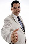 Happy Businessman Offering Hand Shake Stock Photo