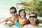 Happy Family In Swimming Pool Stock Photo