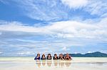 Happy Family Lying Together On The Beach, Thailand Stock Photo