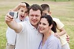 Happy Family Pilled Together And Taking Self Portrait Stock Photo