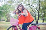 Happy Woman Posing With Bicycle Stock Photo
