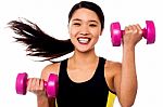 Happy Fitness Woman Lifting Dumbbells Stock Photo