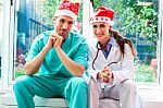 Happy Medical Team Wearing Santa Hats Stock Photo