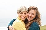 Happy Mother And Daughter Looking At Camera Stock Photo
