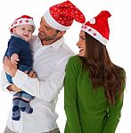 Happy Parents With Son Wearing Santa Hats Stock Photo