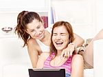 Happy Teenage Girls Using Touchpad Stock Photo
