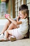 Happy Young Brothers Taking Selfies With Her Smartphone In The P Stock Photo
