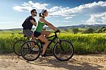 Happy Young  Couple On A Bike Ride In The Countryside Stock Photo