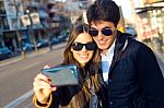Happy Young Couple Taking Selfies With Smartphone Stock Photo