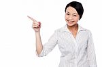 Happy Young Girl Pointing At Copy Space Area Stock Photo