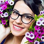 Happy Young Girl With Flowers Stock Photo