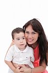 Happy Young Mother And Her Son Posing Together. Isolated Over Wh Stock Photo