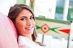 Happy Young Woman Relaxing On Sofa Stock Photo