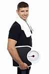 Healthy Young Man With A Weight Scale Stock Photo