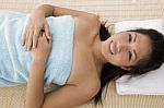 High Angle View Of Smiling Woman Going To Take Massage Stock Photo