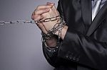 His Hands Are In Chains Stock Photo