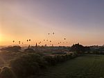 Hot Air Balloons During Sunrise Over Religious Temples Stock Photo