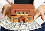 House And Dollar Bills Stock Photo