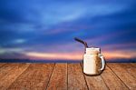 Iced Coffee Cup With Blue Sunset Sky Stock Photo