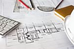 Image Of Blueprints With Level Pencil And Hard Hat On Table Stock Photo