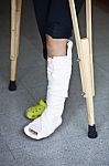 Injured Person With Crutches Stock Photo