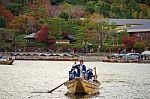 Japanese Men Sail Boat For Tourist At Arashiyama Stock Photo