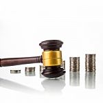 Judges Law Gavel With Coins Stock Photo