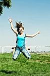 Jumping Girl In Outdoor Stock Photo